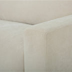 Close-up of the Asha sofa arm, highlighting the quality upholstery and tailored finish.
