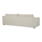 Rear view of the Asha sofa, highlighting its upholstered finish and contemporary silhouette.
