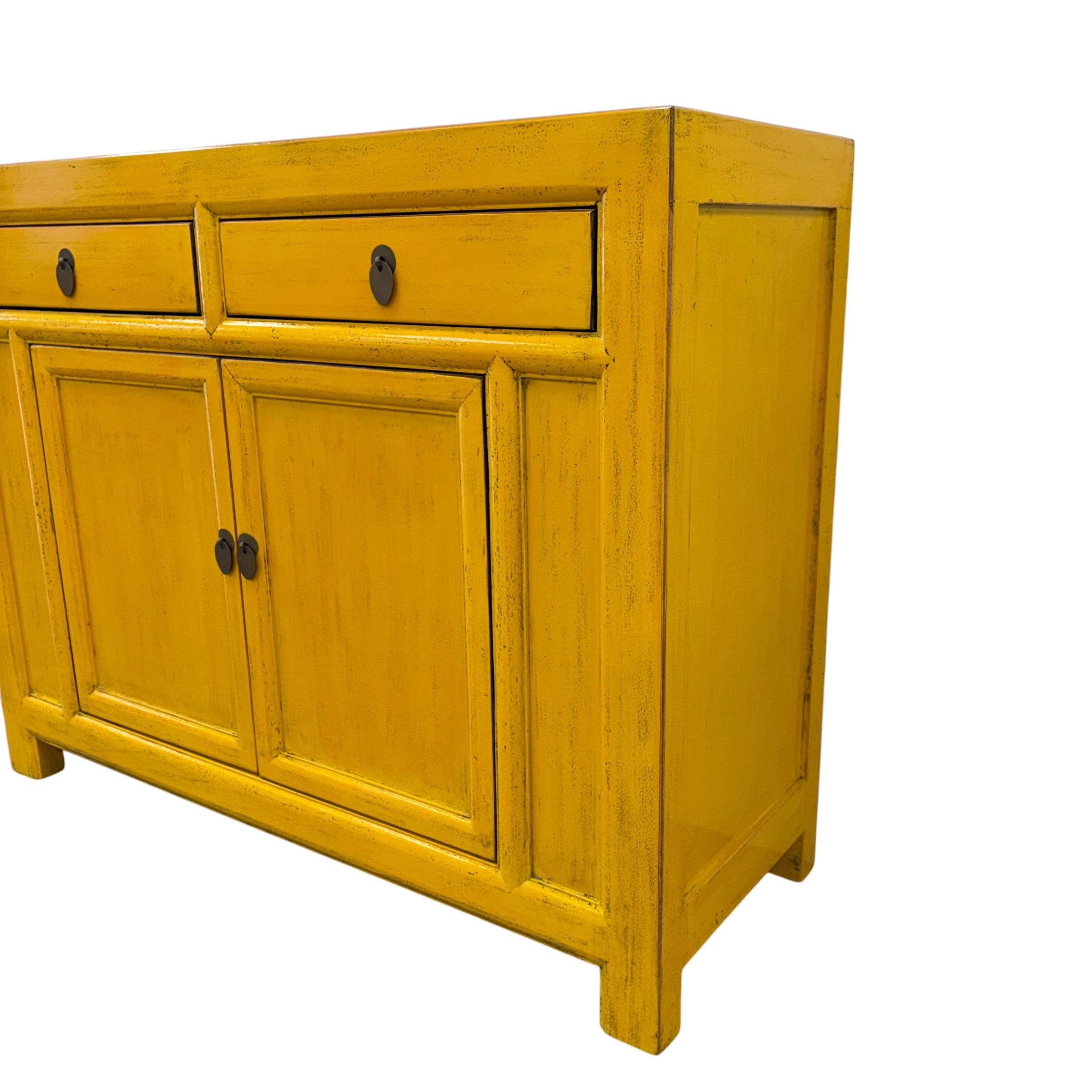 Angled view of Elliot Sideboard in saffron with two drawers, two panelled doors and dark metal handles