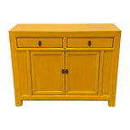 Front angled view of Elliot Sideboard in warm saffron yellow with distressed detailing and panelled doors