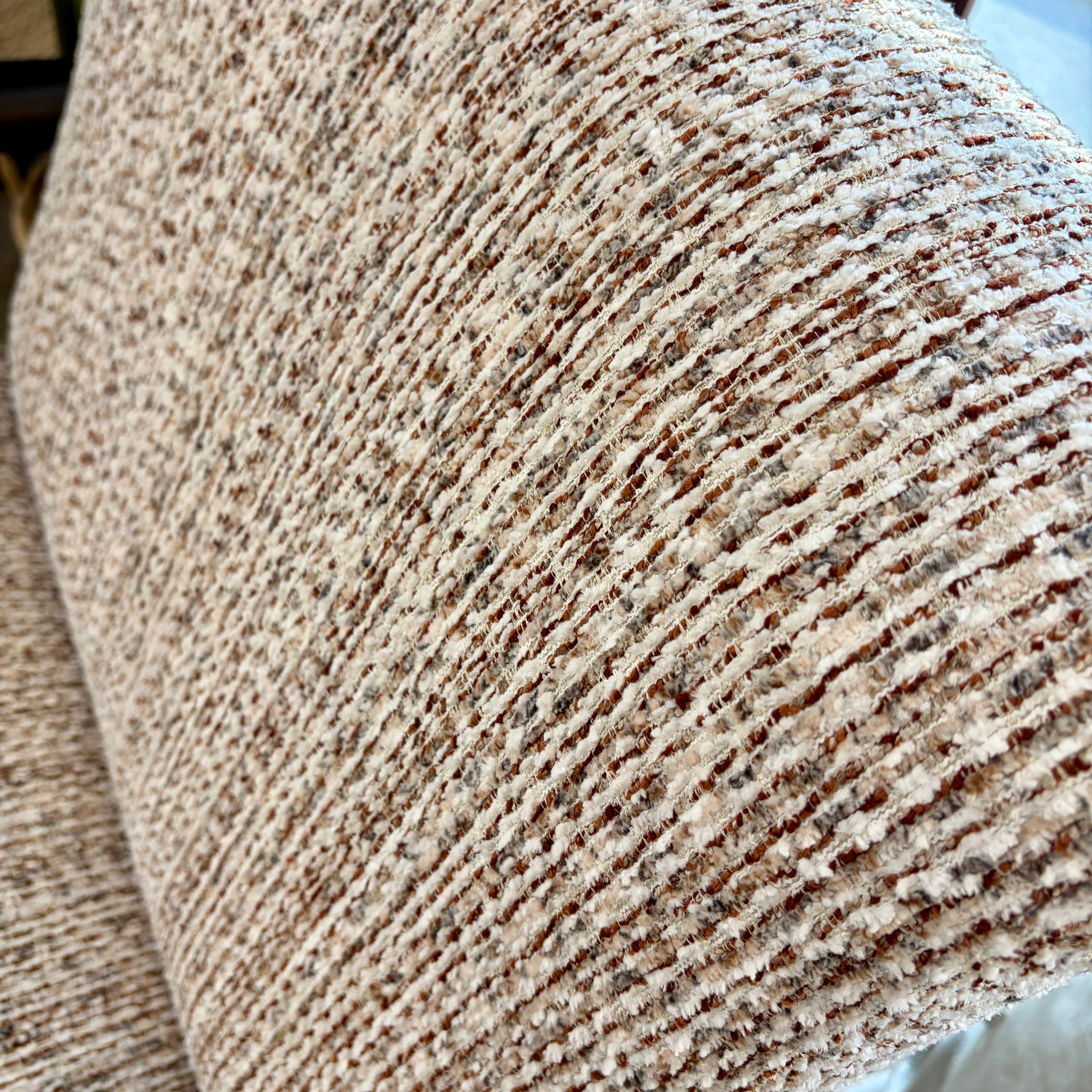 Close-up of the Frankie chair's Nutmeg Cream woven fabric upholstery.