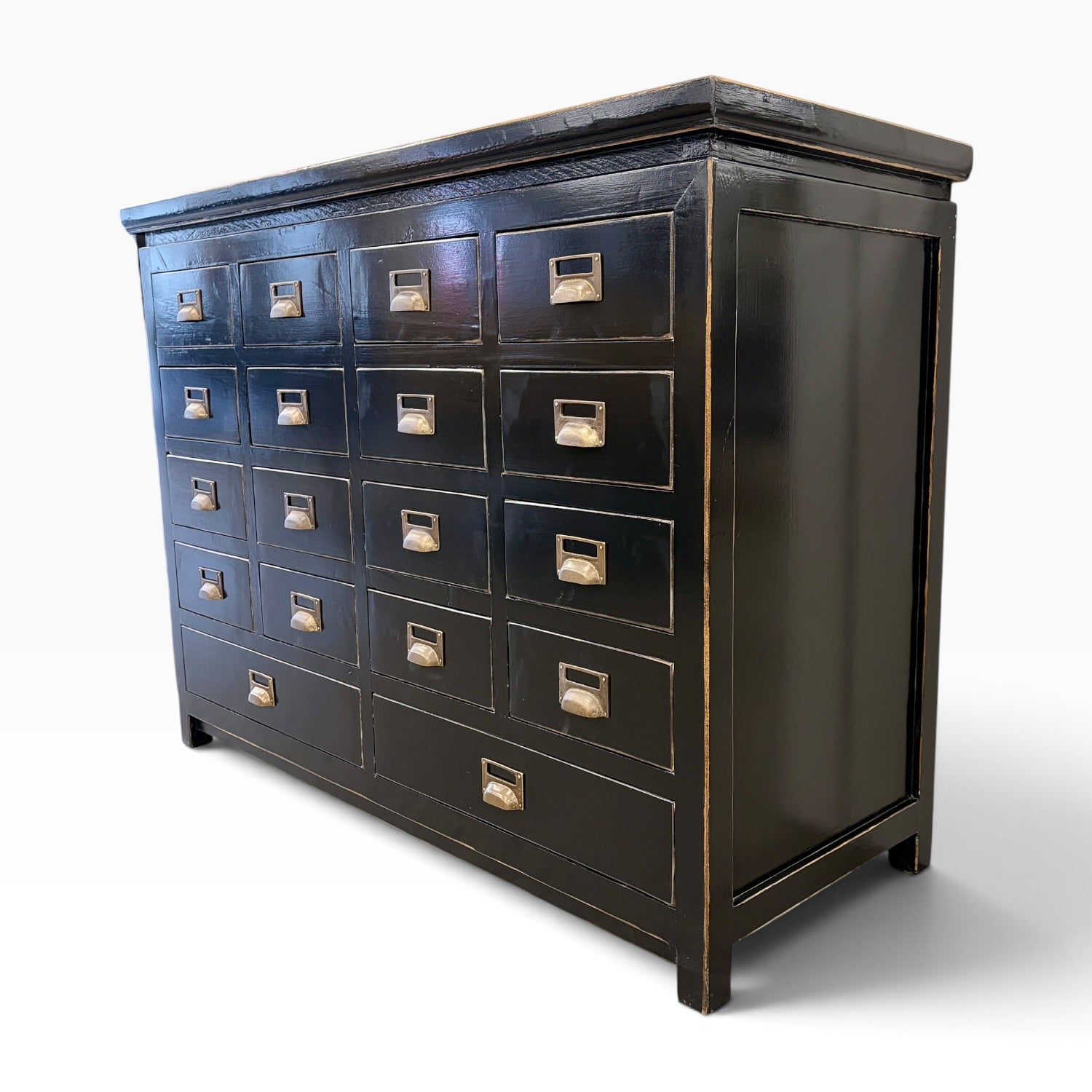 Angled view of Franklin 18 Drawer Cabinet in black with 18 drawers, panelled sides and brass-toned handles
