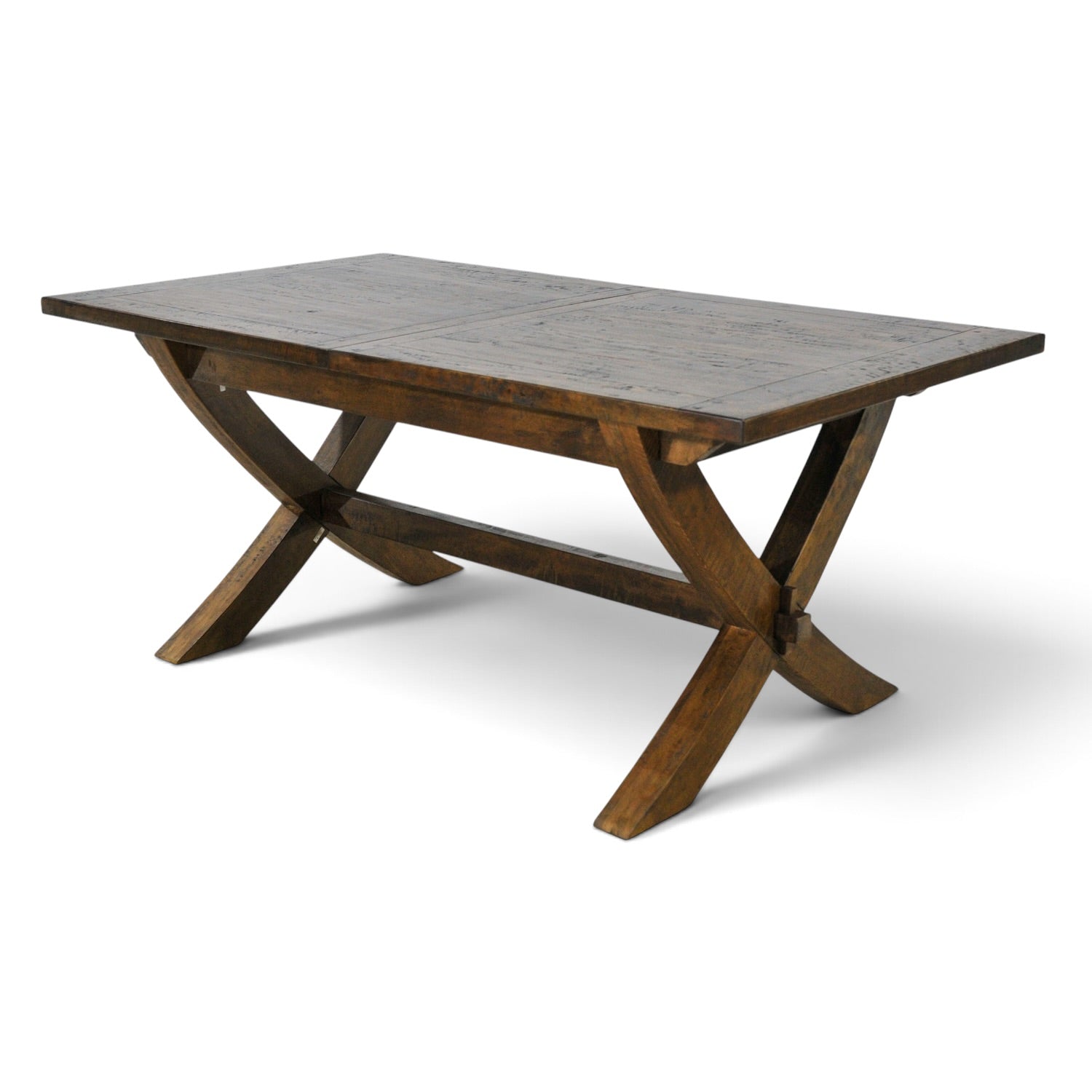 Angled view of the Cross Leg Extension Dining Table showing its rustic timber top and statement cross-leg base.