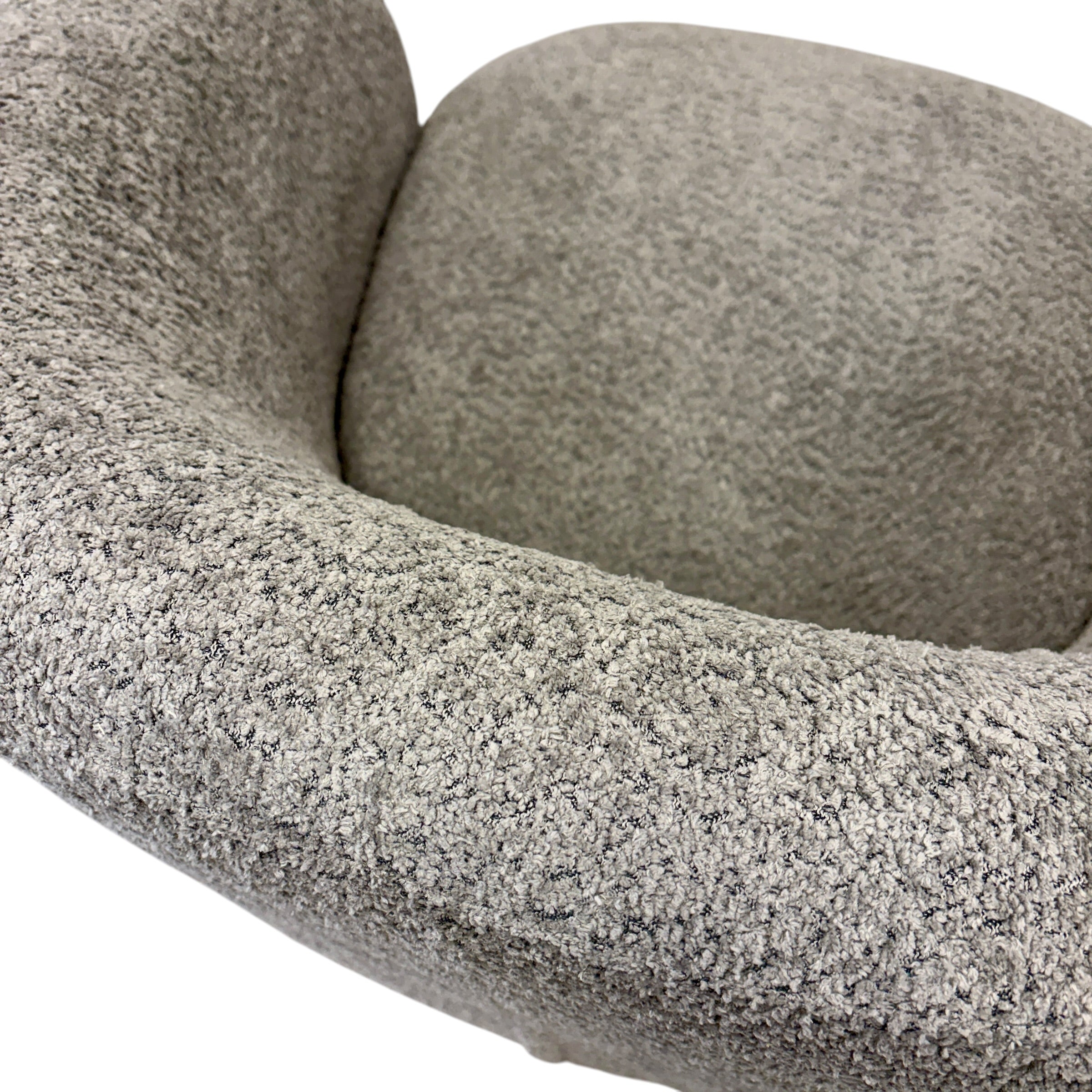 Close-up of the Jenna swivel armchair in Lava, featuring quality upholstery and modern styling.