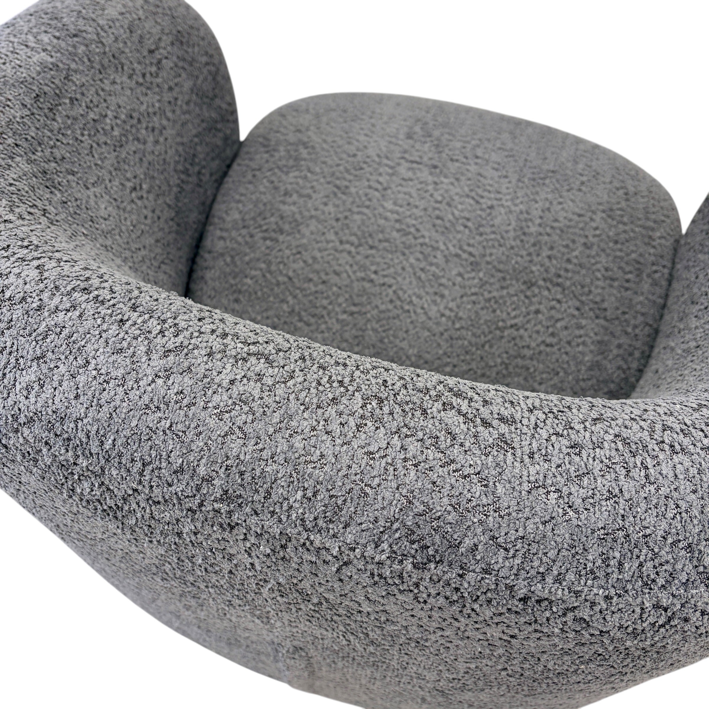 Close-up of the Jenna swivel armchair in Shadow, featuring soft textured upholstery and contemporary styling.