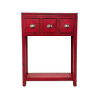 Painted console in bright chili red with three drawers and brass handles.