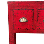 Close up of Juniper console in chilli red with brass handles and distressed finish