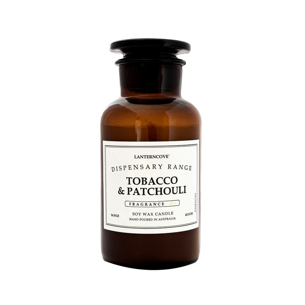 Lantern Cove Tobacco & Patchouli soy wax candle in amber apothecary glass jar