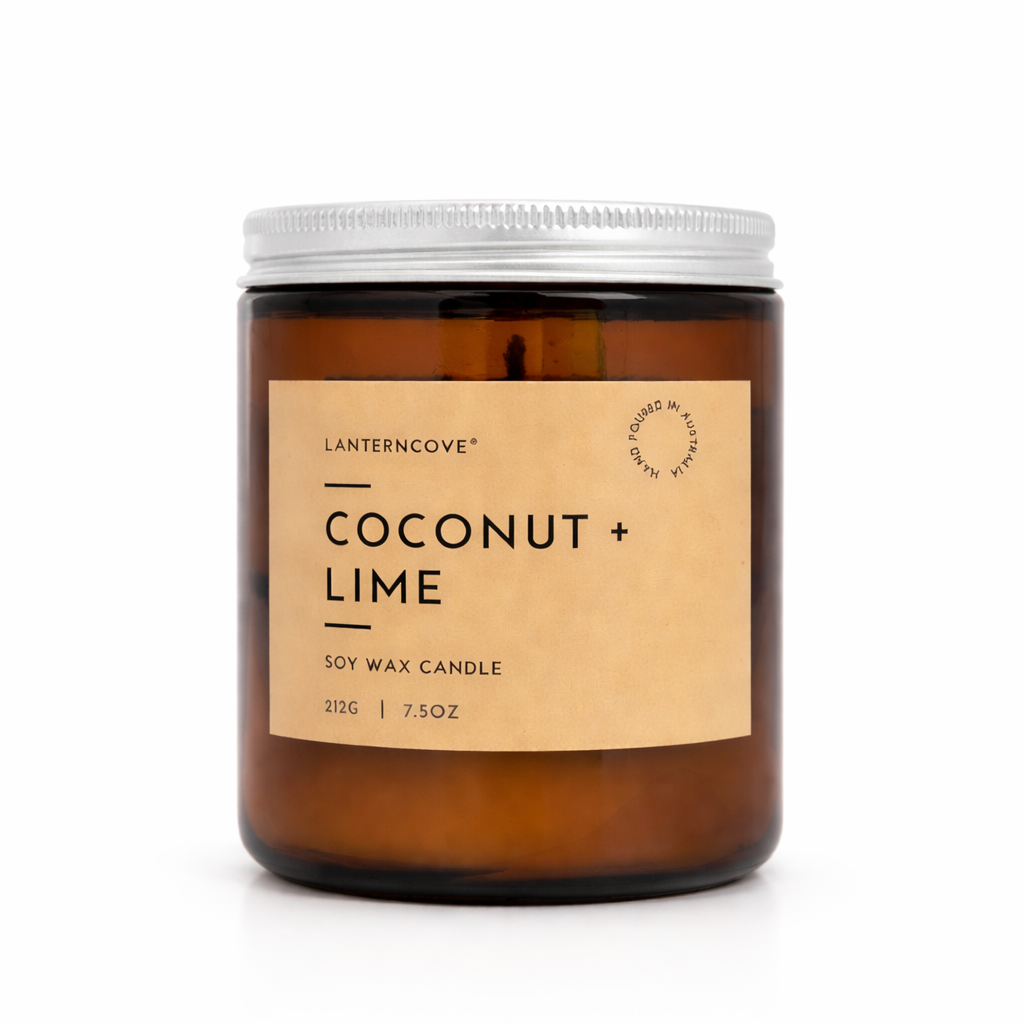 Lantern Cove Glo Coconut & Lime soy wax candle in amber glass jar with silver lid