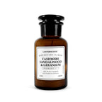 Lantern Cove cashmere sandalwood and geranium soy wax candle in amber apothecary glass jar