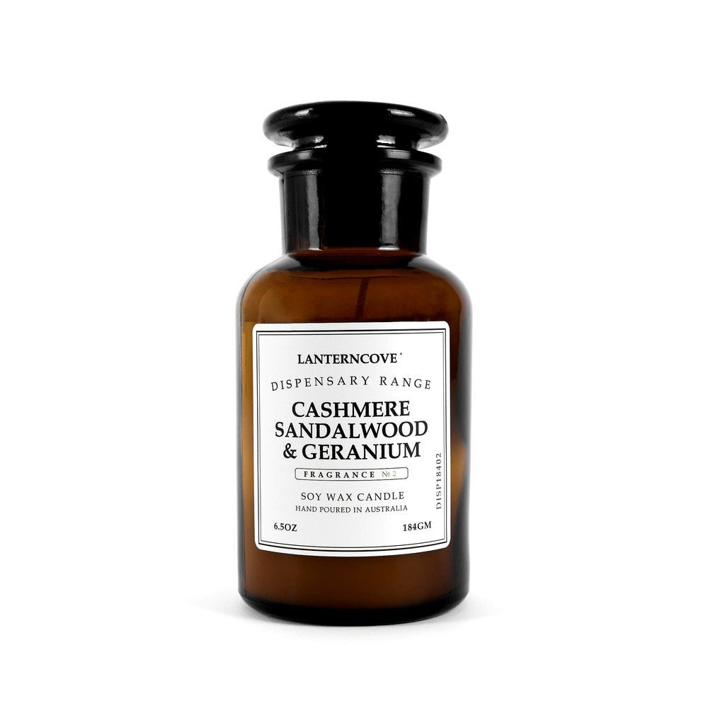 Lantern Cove cashmere sandalwood and geranium soy wax candle in amber apothecary glass jar