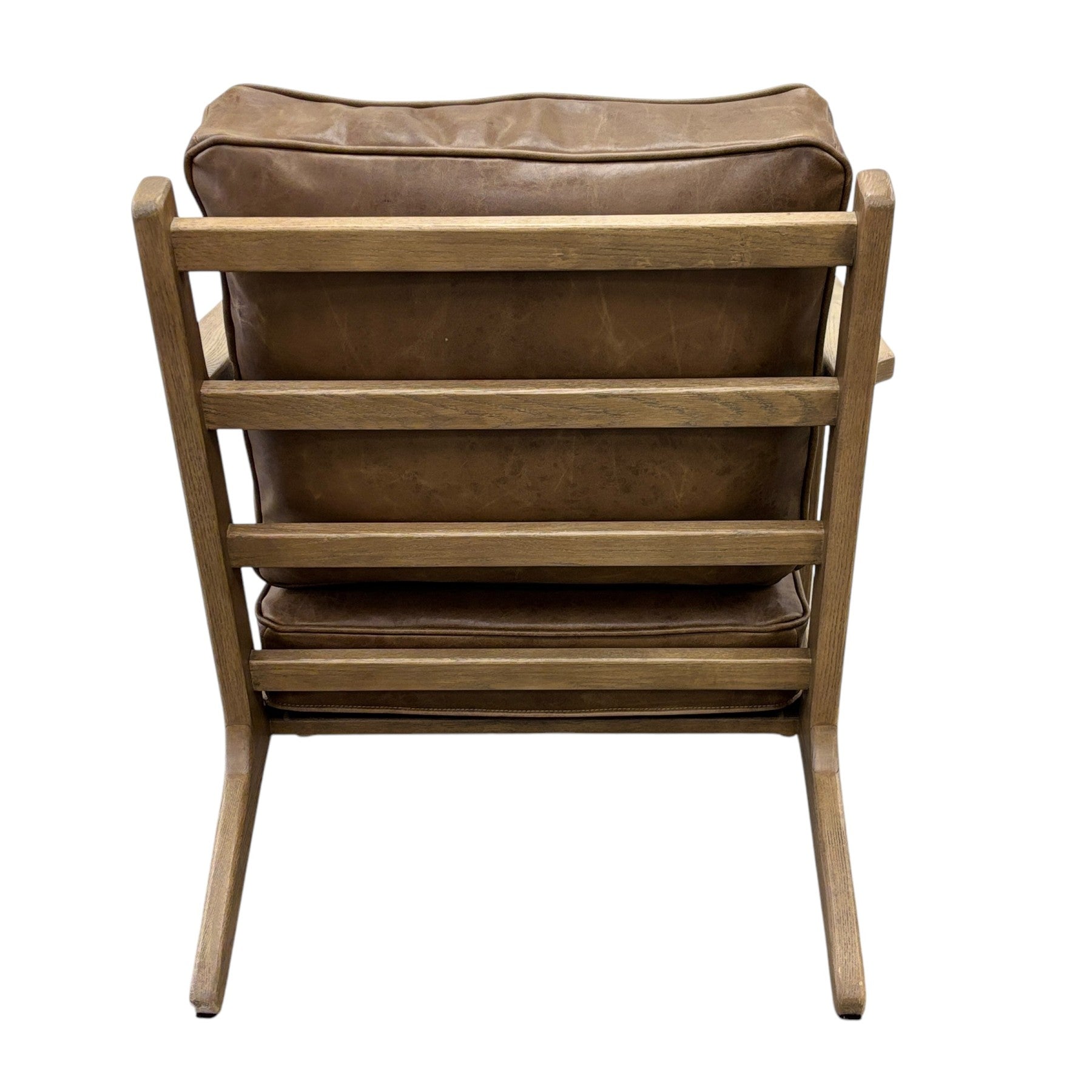 Rear view of the Nero armchair, highlighting its premium leather upholstery and modern design.