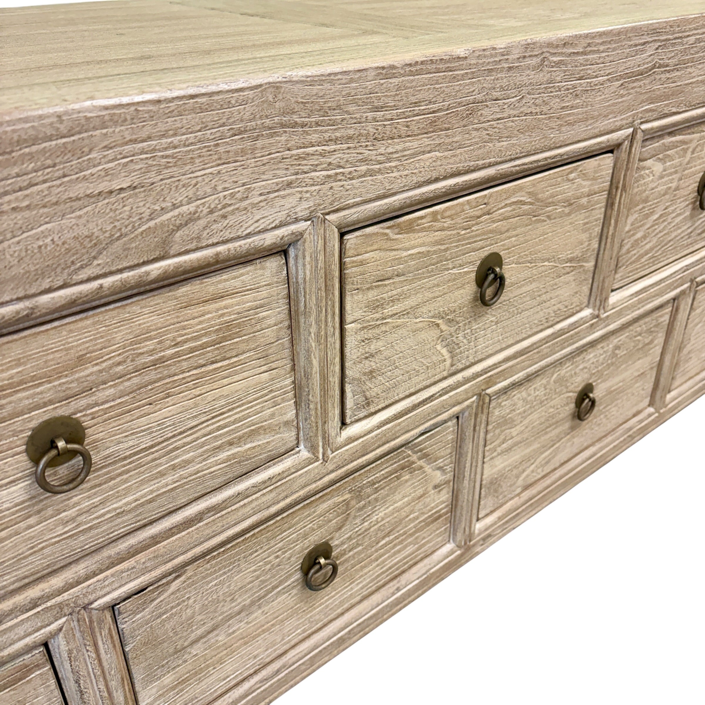 Detail of the natural elm timber grain and panelled top of the Oslo 13 drawer console