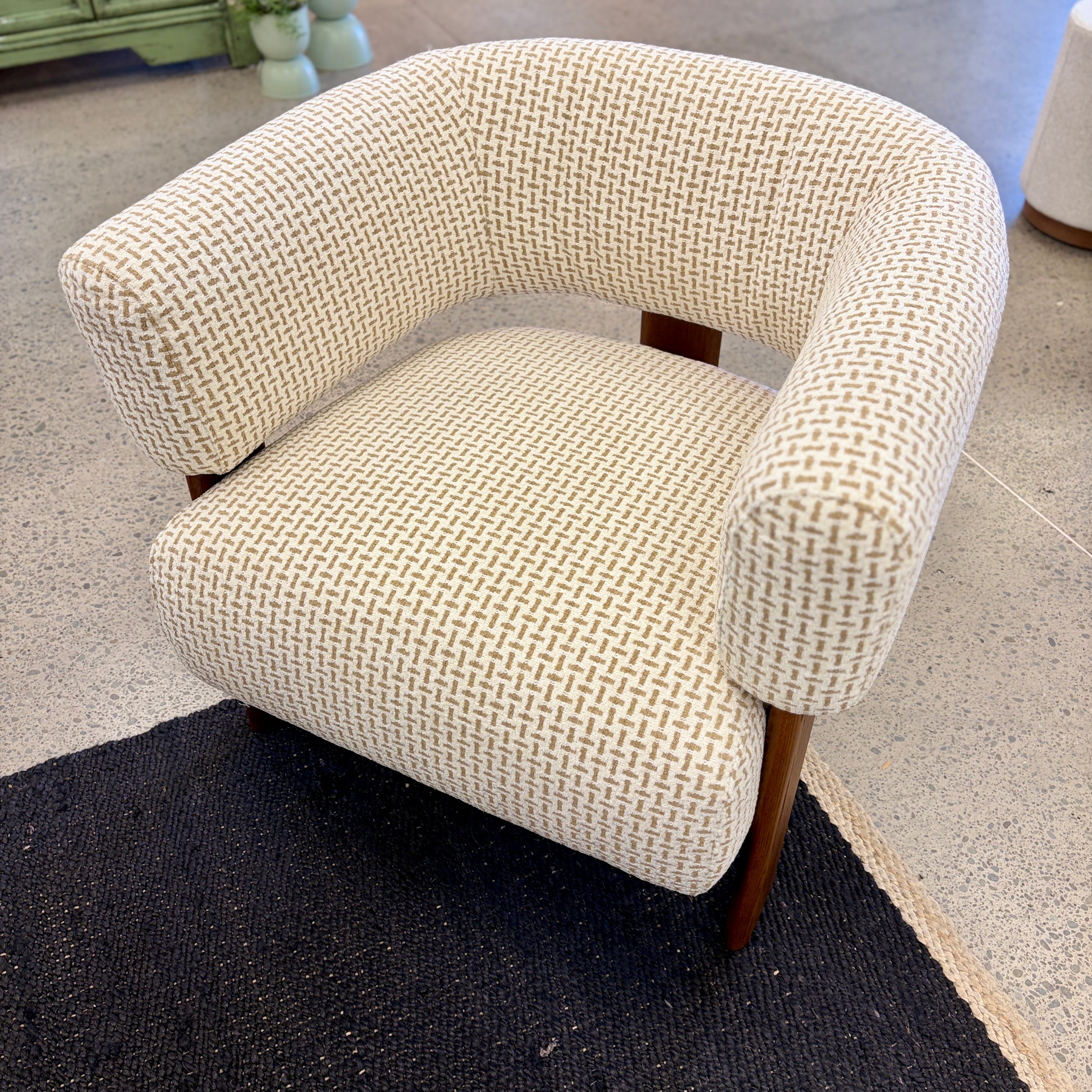 Angled view of the Piper armchair, showcasing its comfortable seat and contemporary silhouette.