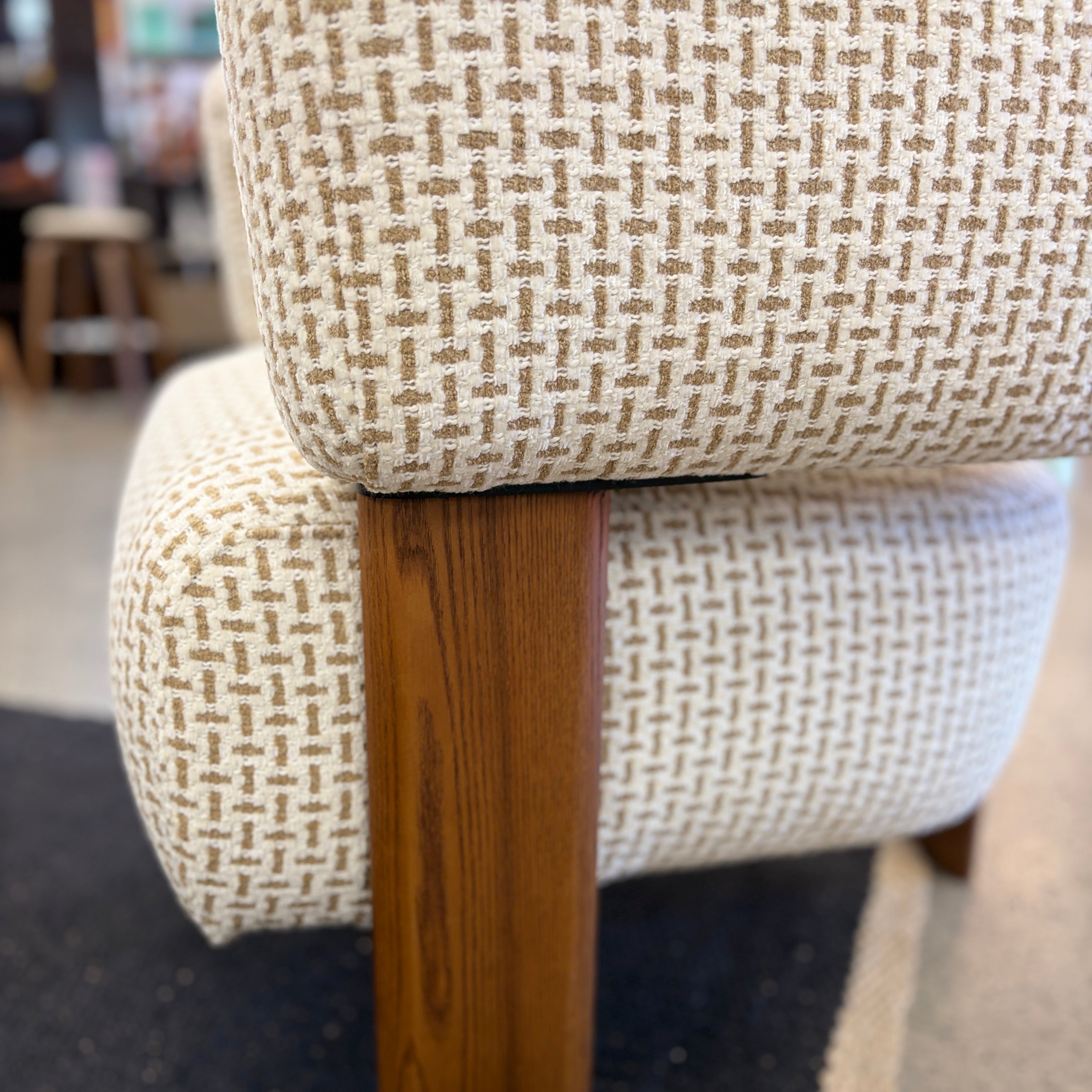 Side profile of the Piper armchair with supportive cushioning and modern styling.