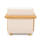 Rear view of the Post armchair, highlighting its timber frame and upholstered backrest.