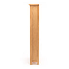 Side view of Salisbury Bookcase showing slim 30cm depth and natural oak finish
