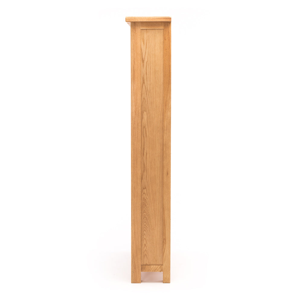 Side view of Salisbury Bookcase showing slim 30cm depth and natural oak finish