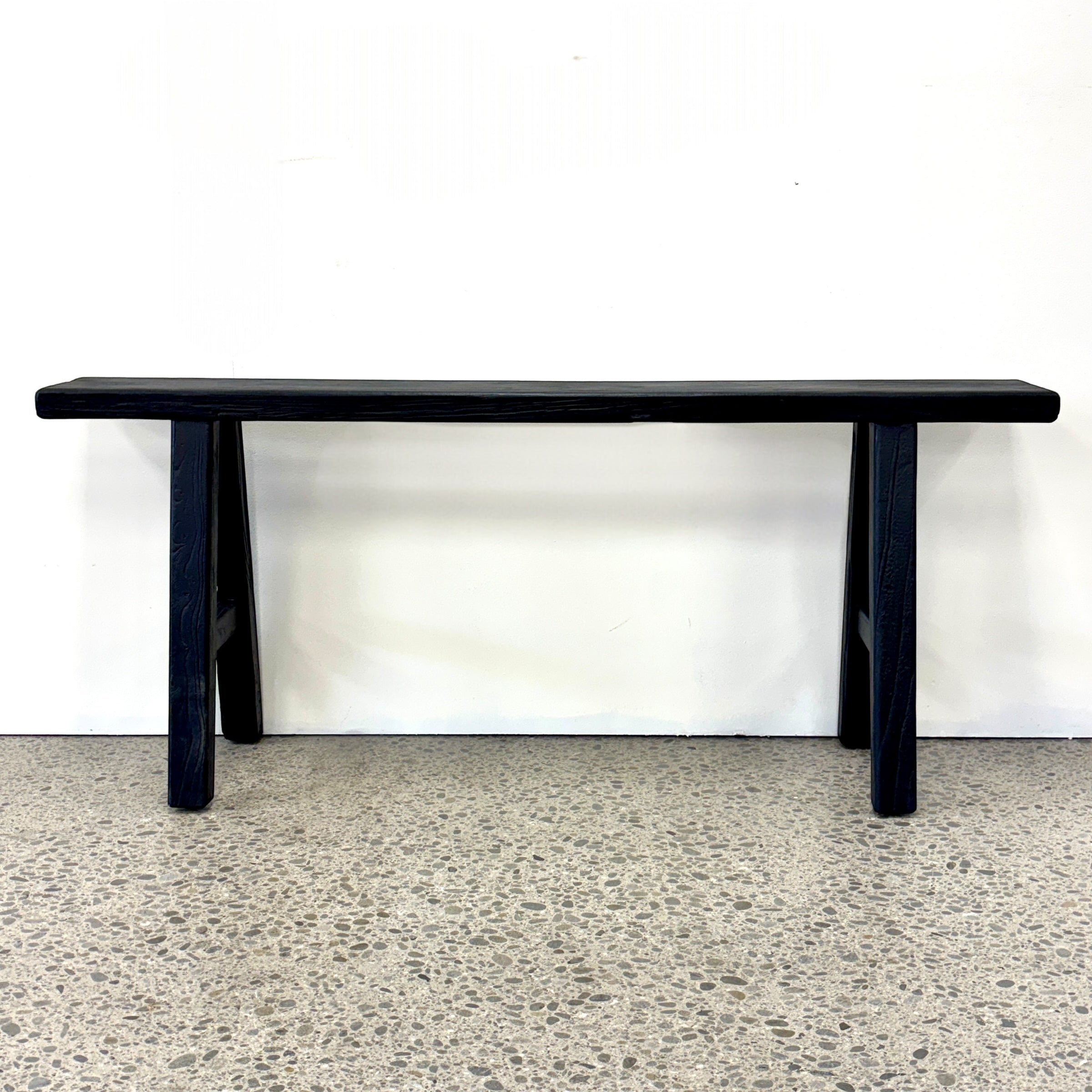 Sammy Bench in black rustic elm with simple timber seat and trestle-style legs