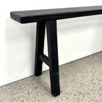 Sammy Bench black rustic elm leg detail showing traditional trestle-style construction