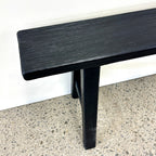 Close-up of Sammy Bench showing black painted finish and natural rustic elm wood grain