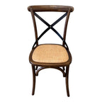 Villa cross back dining chair in deep oak with rattan seat and metal back support and bentwood frame.