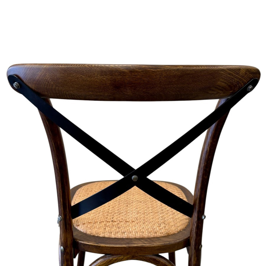 Back view of Villa cross back dining chair in deep oak with rattan seat and metal back support and bentwood leg support