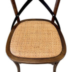 Rattan seat of Villa Cross back dining chair in deep oak timber