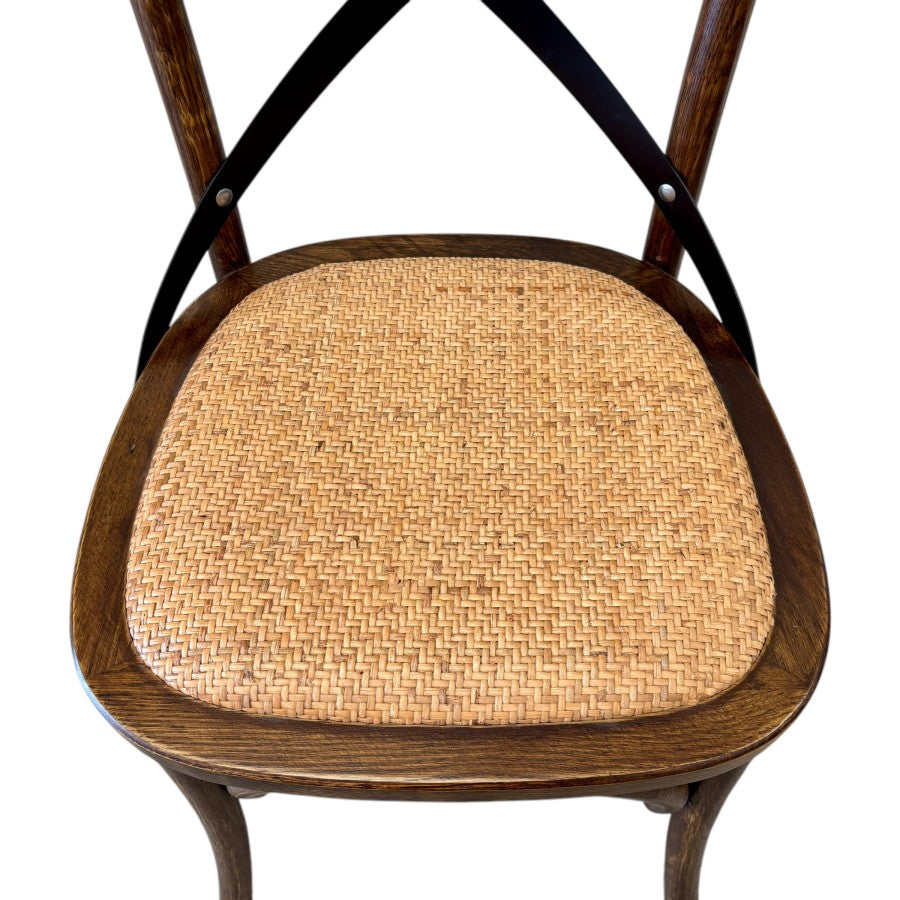 Rattan seat of Villa Cross back dining chair in deep oak timber