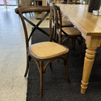 Villa cross back dining chair styled with a dining table in showroom