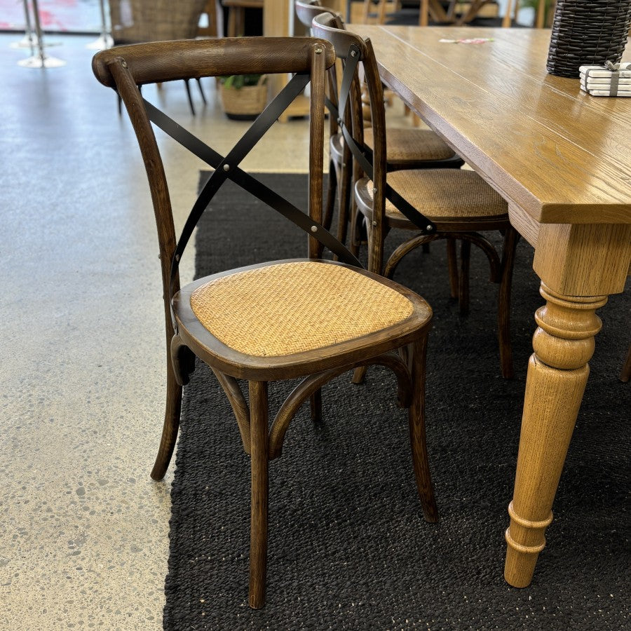 Villa cross back dining chair styled with a dining table in showroom