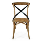 Villa dining chair in smoked oak with woven seat and metal cross back from front view