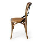 Villa dining chair in smoked oak with a woven seat and metal cross back from side view
