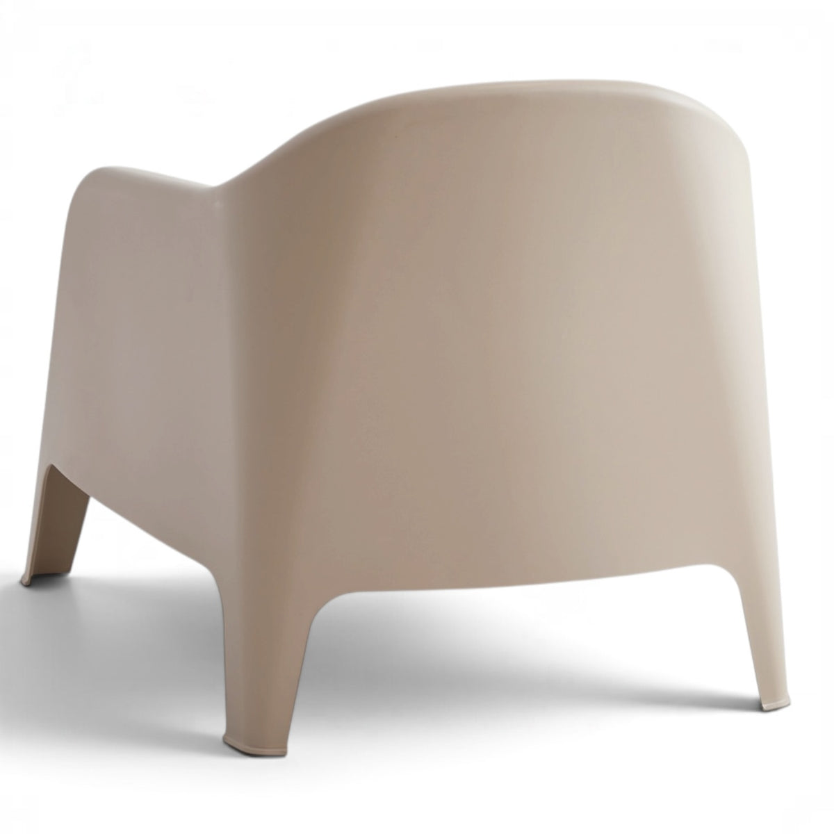 Rear angled view of the Wainui outdoor chair in sand with a contemporary molded design