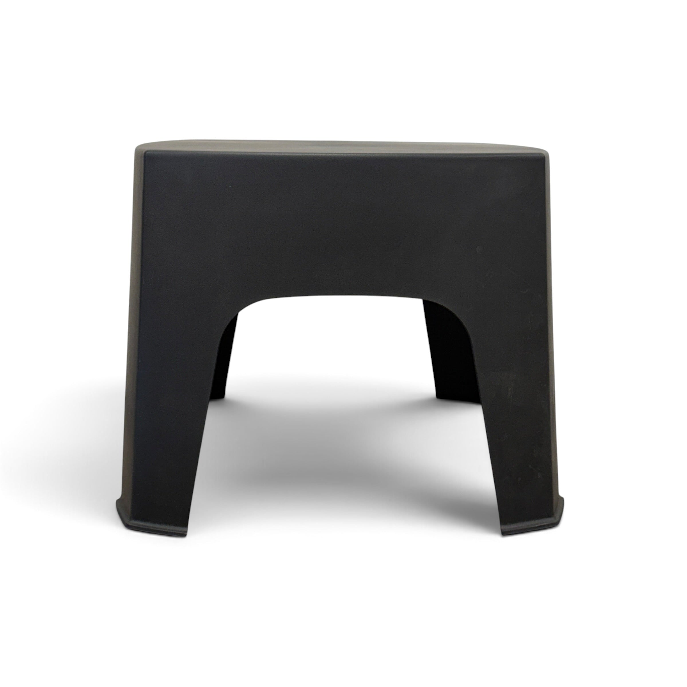 Side view of Wainui black outdoor side table showing its compact curved design