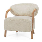 Angled view of the Yak Armchair in Natural with curved timber arms and luxuriously soft faux fur upholstery.
