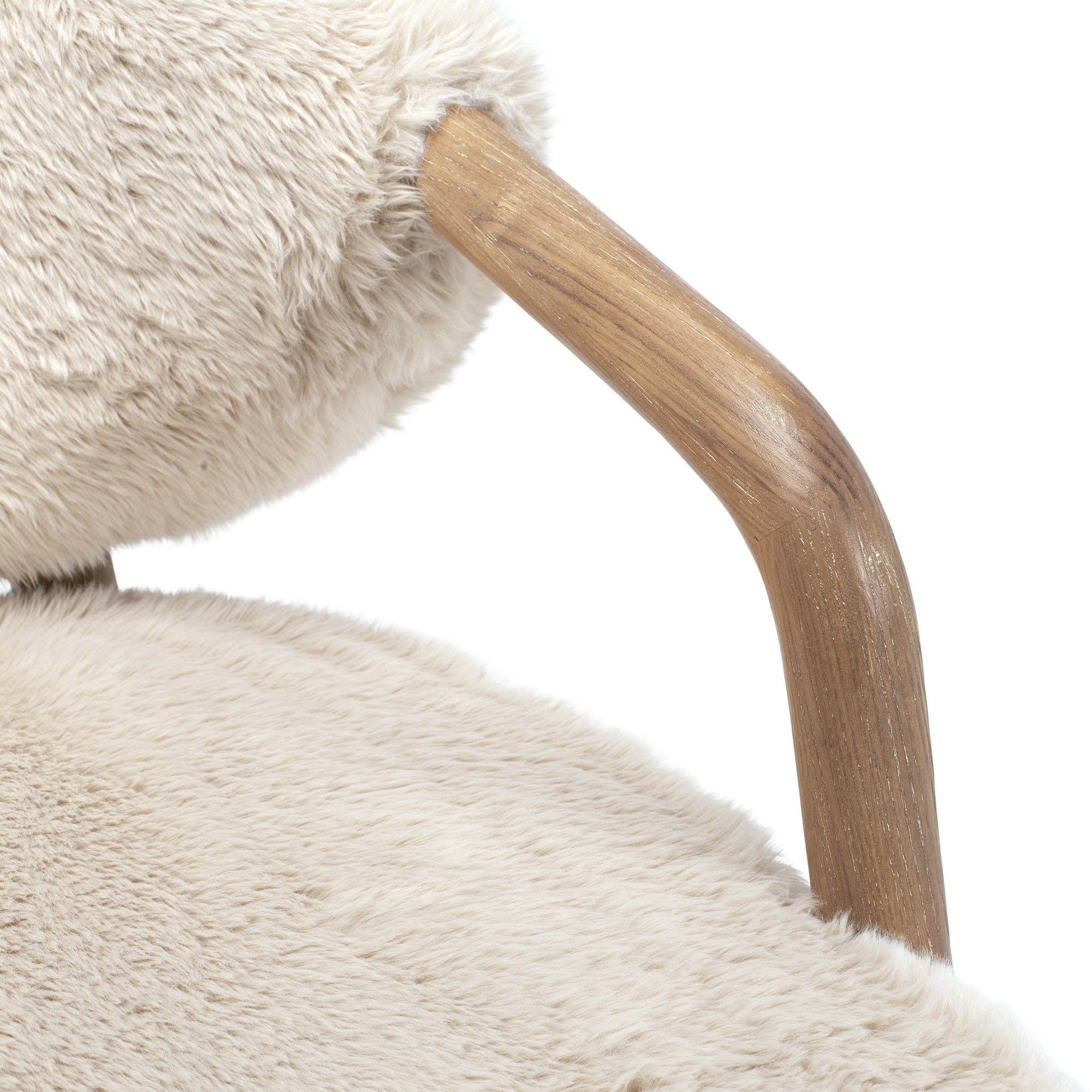 Close-up of the Yak Armchair showing the natural solid ash timber arm and soft faux fur upholstery.