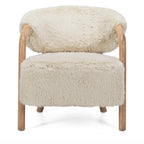 Front view of the Yak Armchair in Natural featuring a rounded silhouette and comfortable upholstered seat.