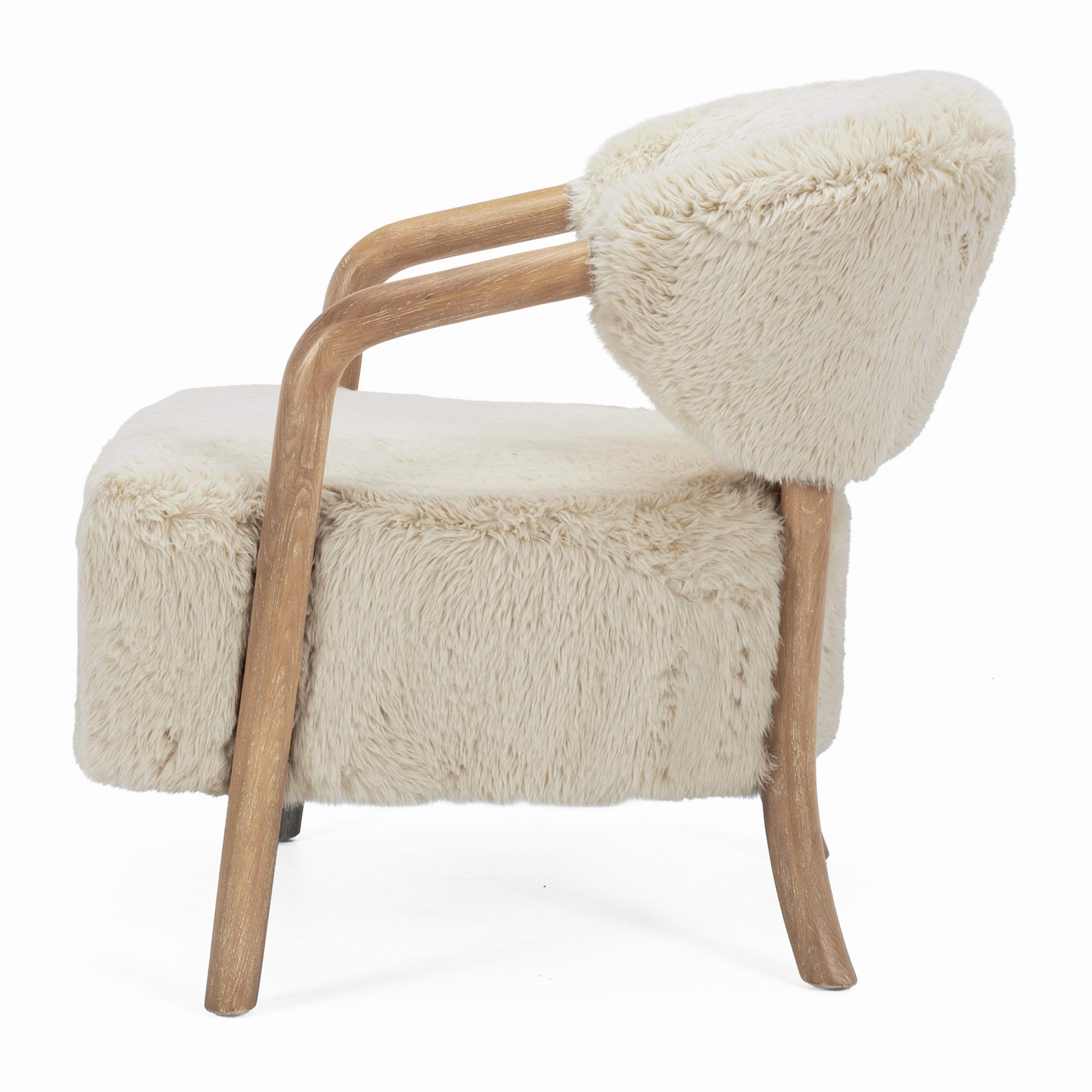 Side profile of the Yak Armchair in Natural showing curved ash timber arms and plush faux fur upholstery.