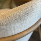 Close-up of the Adeline armchair's 100% natural linen upholstery, highlighting the soft woven texture.