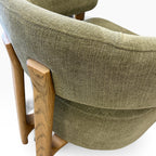 Detailed view of Aiden Chair in Kiwi showing textured fabric, curved backrest and timber frame