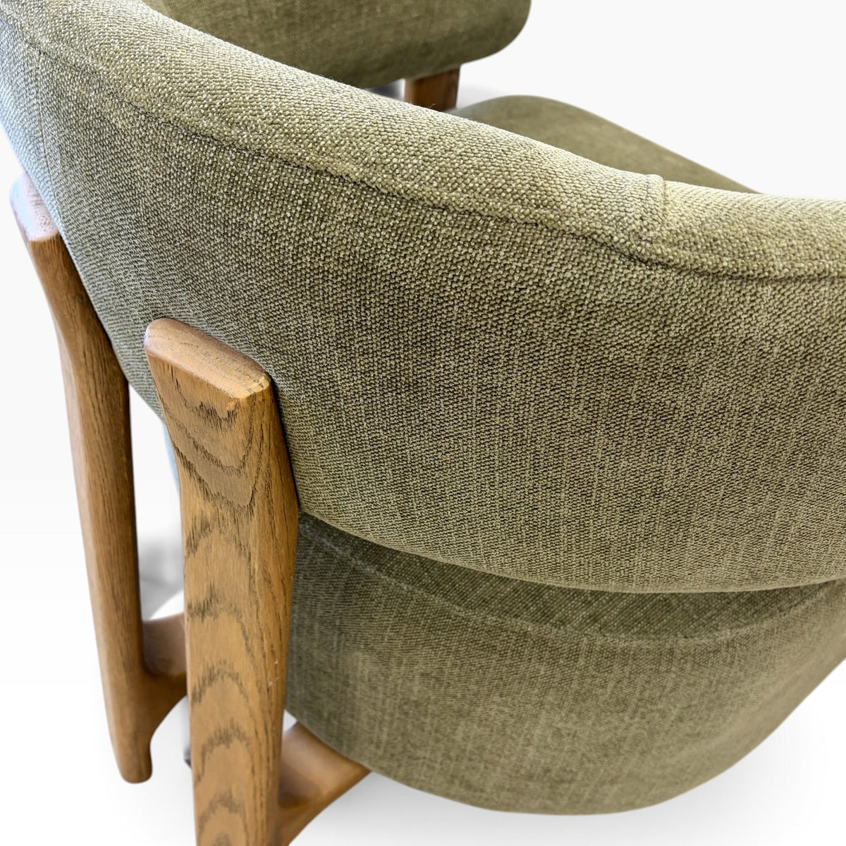 Detailed view of Aiden Chair in Kiwi showing textured fabric, curved backrest and timber frame