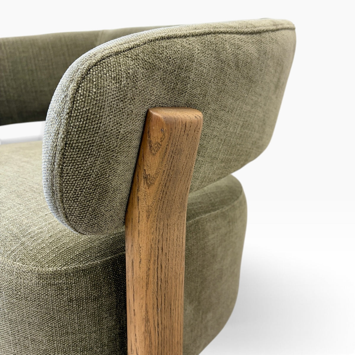 Aiden Chair in Kiwi showing rounded upholstered backrest and natural timber grain