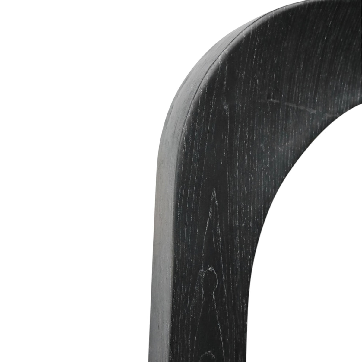 Close-up of Amalie Mirror black frame showing subtle timber grain and softly rounded edges