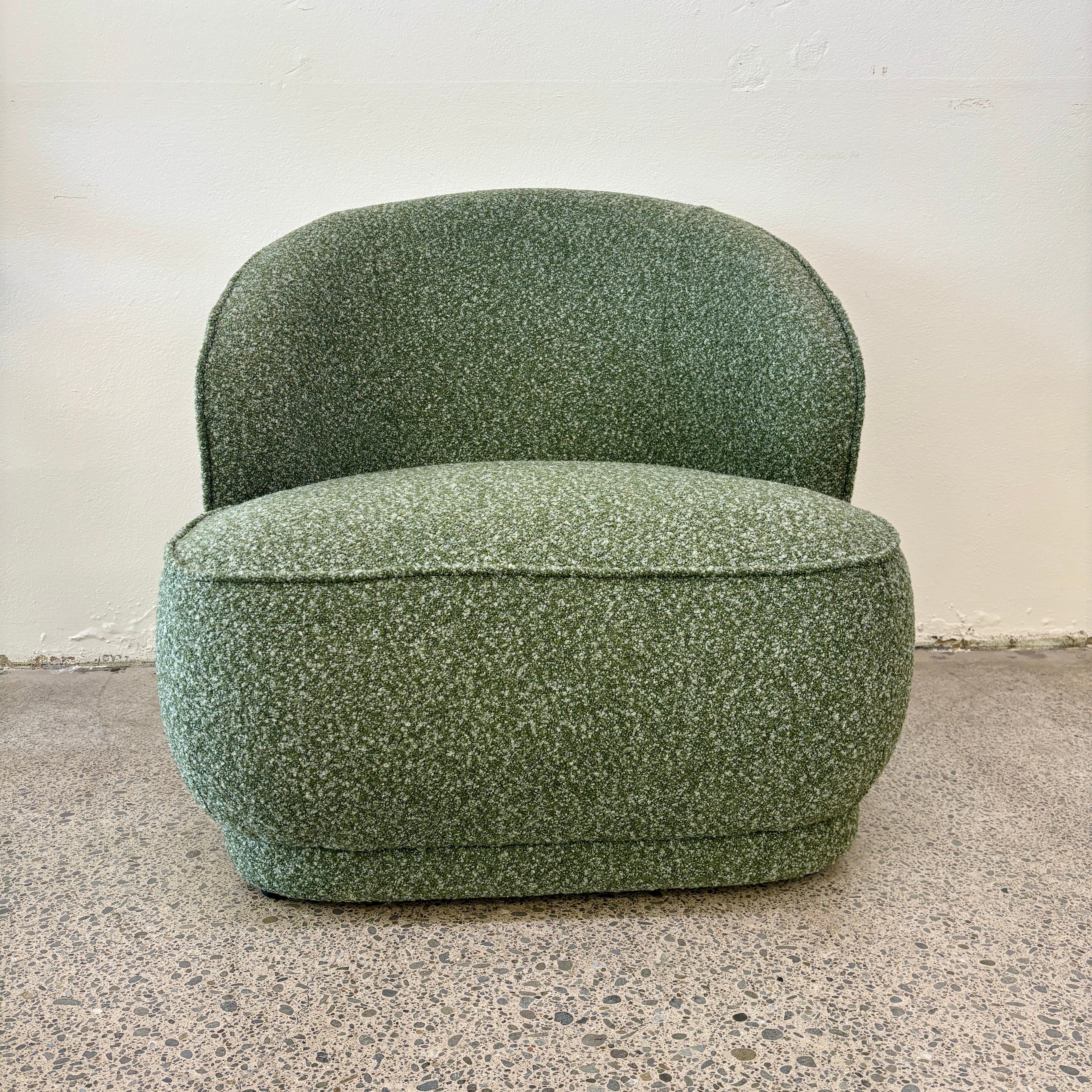 Angled view of the Arlo Chair in Fern with feather-filled cushions, soft upholstery and a beautifully crafted oak frame.