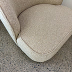 Close-up of the Arlo Chair's Grain fabric, showcasing the soft woven texture and premium upholstery finish.