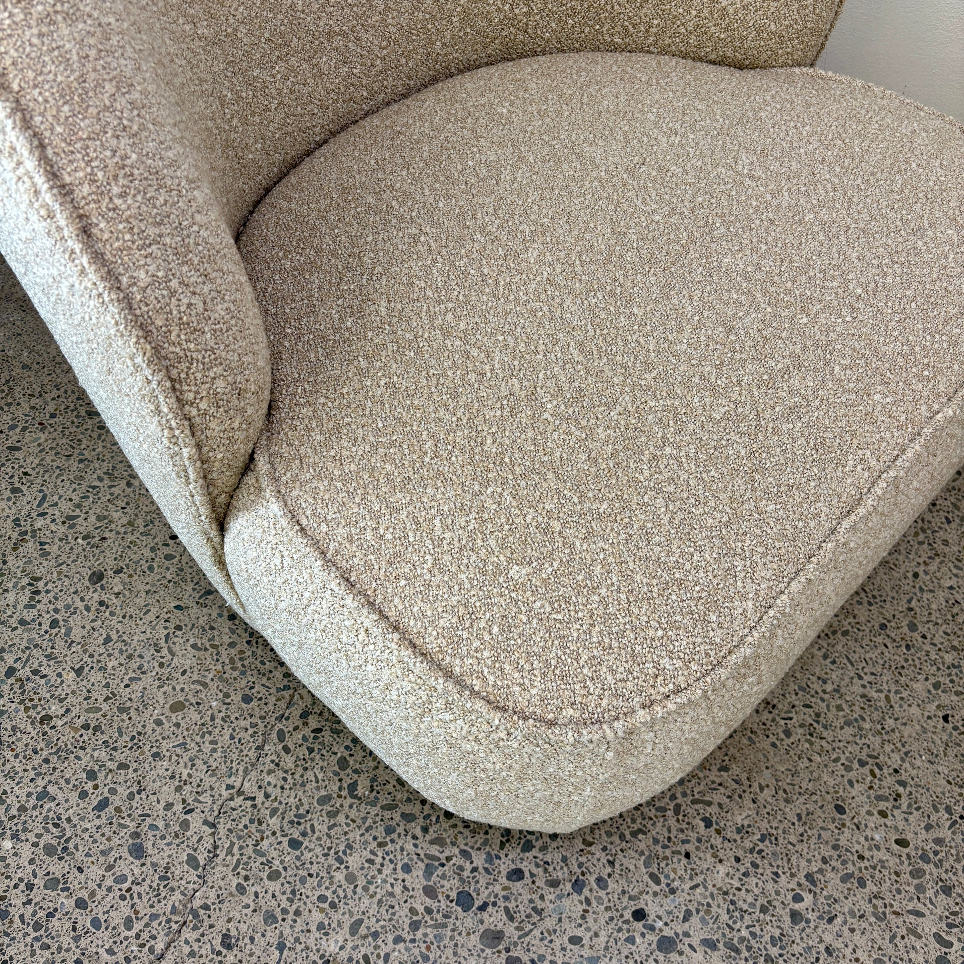 Close-up of the Arlo Chair's Grain fabric, showcasing the soft woven texture and premium upholstery finish.