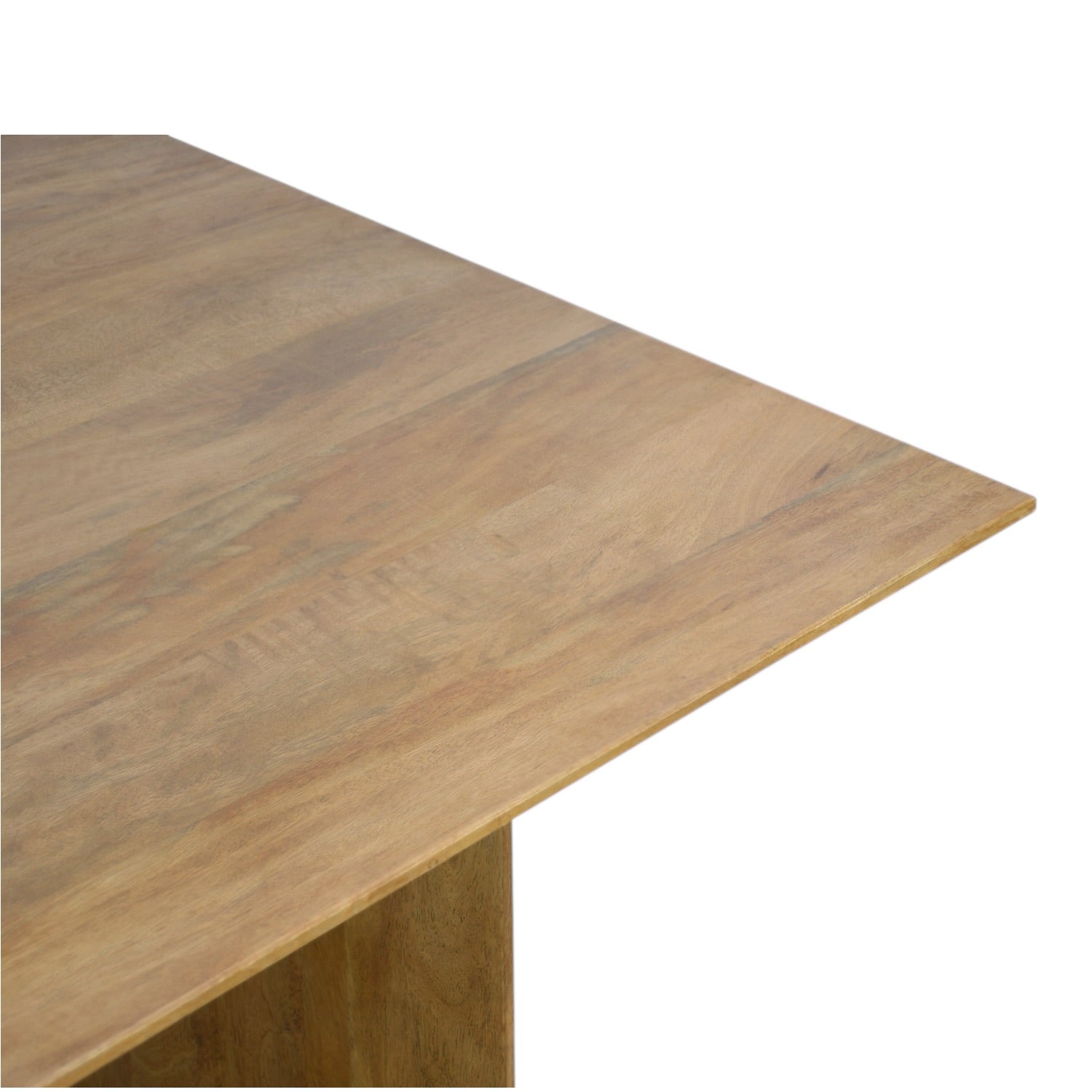 Corner detail of the Ava Dining Table in Natural, highlighting the softly rounded edges, smooth finish and natural mango wood grain.