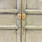 Close up of Ayla Storage Cupboard Smoke showing textured olive grey finish and gold toned handles