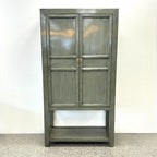 Ayla Storage Cupboard Smoke front view with panelled doors, gold toned handles and open lower shelf